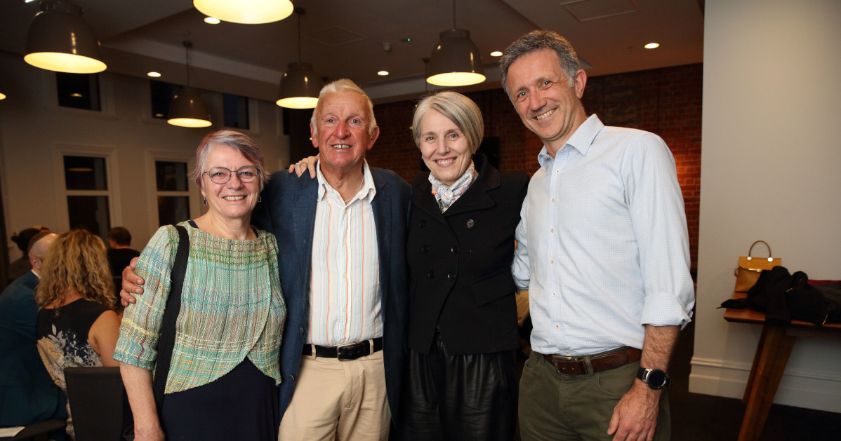 Four ACAH colleagues standing together at an event